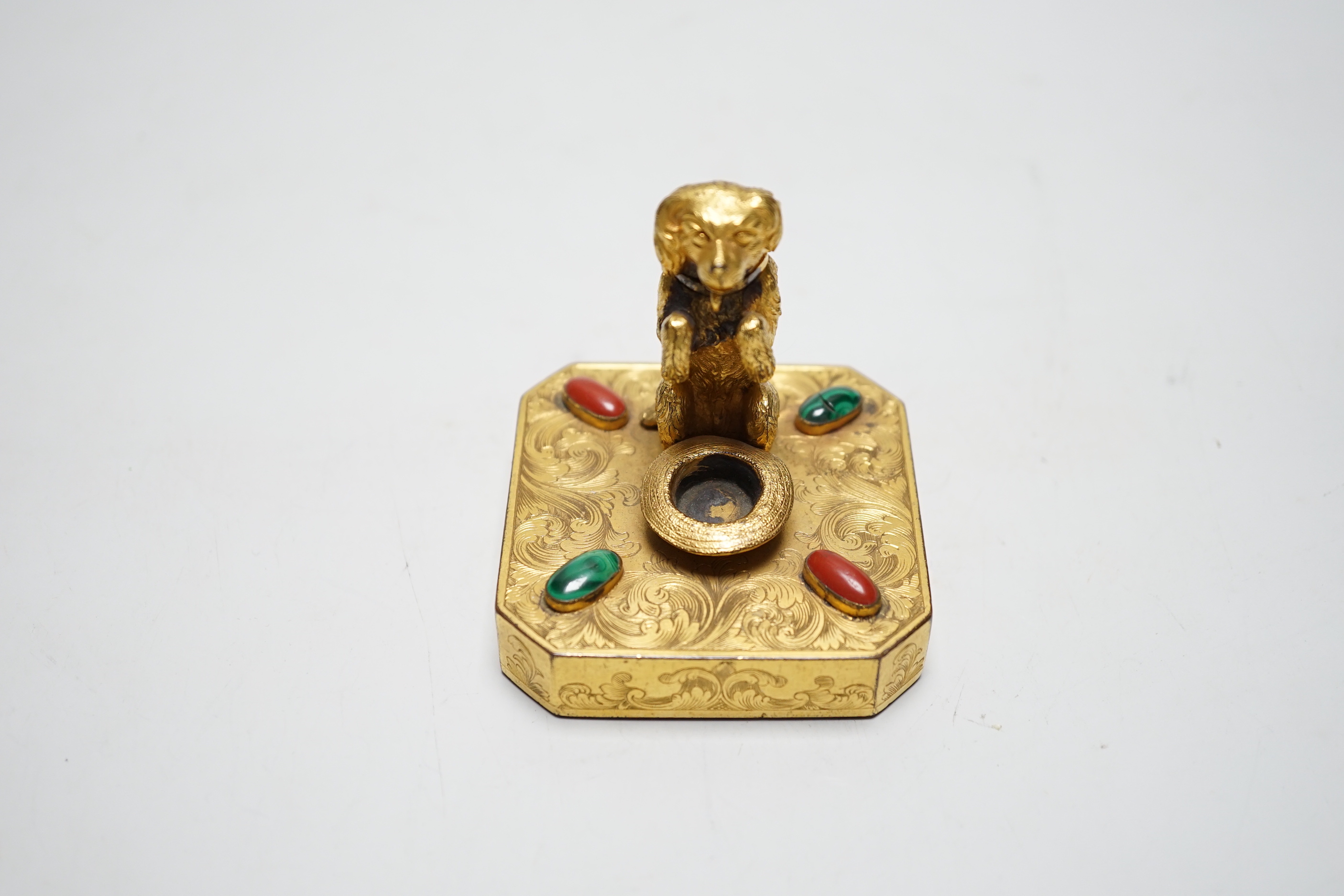 A 19th century Palais Royal ormolu ‘begging dog’ taper holder, 7cm